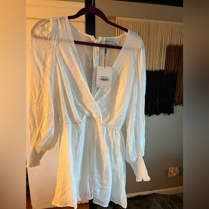 Brand new with tags. Hello Molly White Romper, size small.